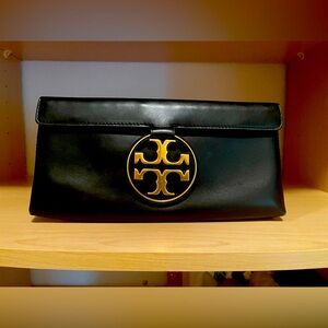 Stunning Tory Burch black leather clutch.